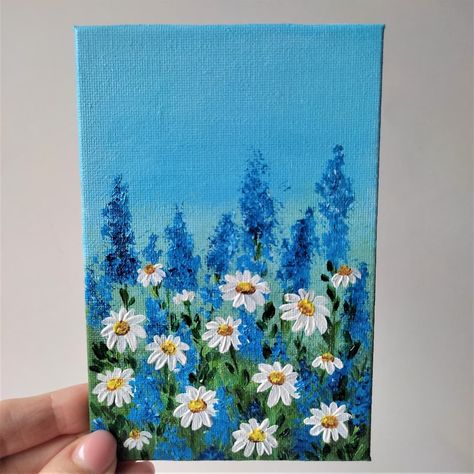 Daisies painting. 100% handpainted by the artist.The painting will be carefully packed and shipped in a beautiful package. I will do my best to ensure that the painting arrives in perfect condition.Composition: acrylic, canvas boardSize: 6 x 4 inches (15 x 10 centimeters).Handpainted with professional acrylic paints for painting.CarePaintings cannot be washed with water or other cleaning agents and chemicals. Do not use a vacuum cleaner or other vacuum cleaner.Use a soft brush or a soft dry clot Things To Paint On Canvas Flowers, Simple Paintings Flowers Easy, Acrylic Paint Ideas, Tiny Canvas Painting, Daisies Painting, Flower Art Wall, Flower Painting Acrylic, Beautiful Acrylic Painting, Chamomile Flower