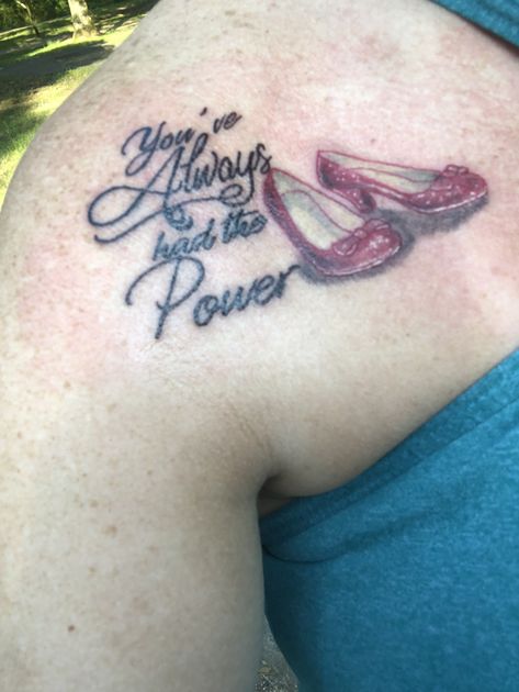 Ruby slippers. Wizard of oz. tattoo Tiny Wizard Of Oz Tattoo, The Power Tattoo, Wizard Of Oz Tattoo Simple, Wizard Of Oz Tattoo Ideas, Ruby Slippers Tattoo, Ruby Slippers Wizard Of Oz, Wizard Of Oz Tattoo, Feminine Arm Tattoos, Crown Tattoos For Women