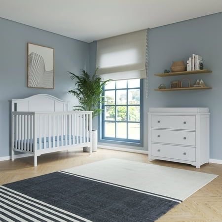 The Cottage Arch Top furniture collection adds charm and elegance to any nursery with its soft, arched details and beadboard headboard. This 3-piece furniture set includes the Cottage Arch Top 4-in-1 Convertible Crib, the Harmony Dresser, and a Changing Table Topper. The Cottage Arch Top collection is available in 3 clean, sophisticated finishes, designed to fit into any nursery design: Matte White, Dapper Gray, and Dusty Heather. The Cottage Arch Top 4-in-1 Convertible Crib can be converted from a crib into a toddler bed, daybed, and full-size bed, intended to grow with your child from baby to teen. To convert the Cottage Arch Top 4-in-1 Convertible Crib into a toddler bed, use the toddler conversion rail (F09501, sold separately). For the full-size bed conversion, you will need the full- Light Blue Nursery Boy, Dresser And Changing Table, Beadboard Headboard, Light Blue Nursery, Craft Cottage, 4 In 1 Crib, Blue Nursery Boy, Changing Table Topper, Nursery Changing Table