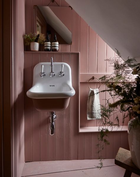 This is a newly created en suite by Lauren Caisley, an interior designer, in the corner of an attic bedroom in a grade II listed Georgian house in Buckinghamshire. “The space measures just four square metres. I added the tongue-and-groove panelling to give interest and depth, and painted the entire room in Farrow & Ball’s Sulking Room Pink.” Tongue And Groove Cloakroom Toilet, Tongue And Groove Bathroom, Sulking Room Pink, Attic Bathroom Ideas, Downstairs Loo, Attic Bathroom, Downstairs Toilet, Cottage Bathroom, Small Toilet