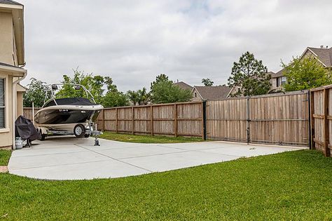 A big "plus" for boat owners is this boat/RV storage pad. A triple wide gated driveway from the side street makes it easy to keep your boat handy. Boat Parking In Yard, Gated Driveway, Poured Concrete Patio, Boat Storage, Rv Storage, Poured Concrete, Concrete Patio, Patio Ideas, Backyard Ideas