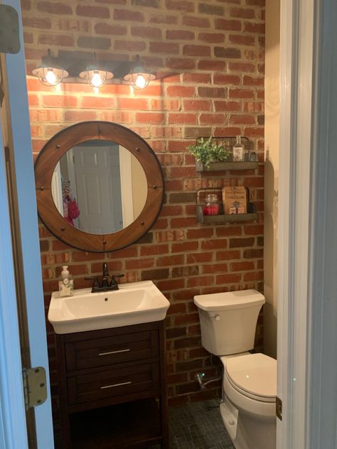 Brick Wall Interior Bathroom, Bathroom With Brick Wall, Brick Bathroom Ideas, Small Half Bath Remodel, Brick Bathroom Wall, Half Brick Wall, Brick Wall Bathroom, Closet With Vanity, Blue Tile Floor