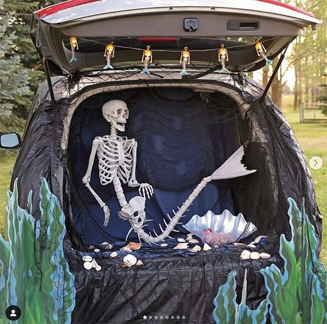 A trunk decorated with an under the sea scene. Inside the trunk is a skeleton mermaid. This is a fun idea for a scary trunk or treat theme | The Dating Divas Mermaid Trunk Or Treat, Easy Trunk Or Treat Ideas, Easy Trunk Or Treat, Trunker Treat Ideas, Zoo Boo, Trunk Or Treat Ideas, Mermaid Skeleton, Candy Display, Mermaid Diy