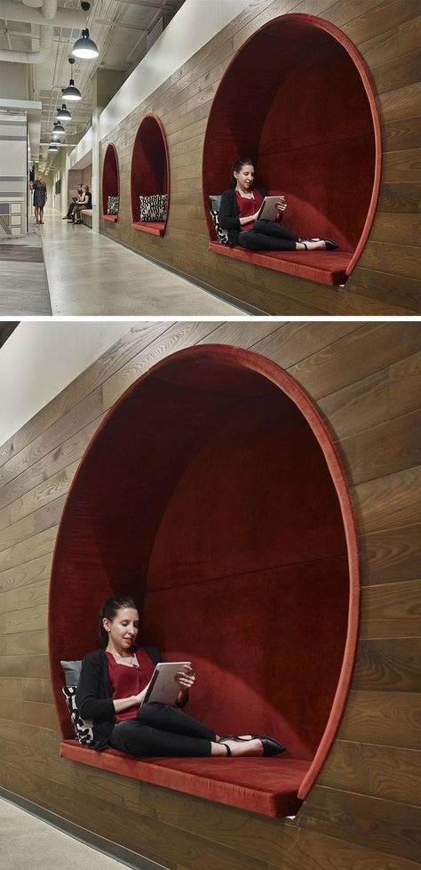 In this modern office, three circular seating nooks with red upholstered cushions are embedded within a dark wood wall, creating a cozy and intimate environment to work or take time away from a screen. Office Reception Seating, Circular Seating, Office Design Trends, Cool Office Space, Modern Office Interiors, Corporate Office Design, Modern Office Design, Wall Seating, Office Reception