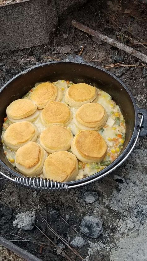 Campfire Chicken And Dumplings, Campfire Chicken Pot Pie, Dutch Oven Chicken Pot Pie Camping, Camping Chicken Pot Pie, Campfire Food Ideas Dinner, Camp Fire Dutch Oven Meals, Campfire Cooking Dutch Oven, Dutch Oven Chicken Pot Pie Biscuits, Dutch Oven Pot Pie