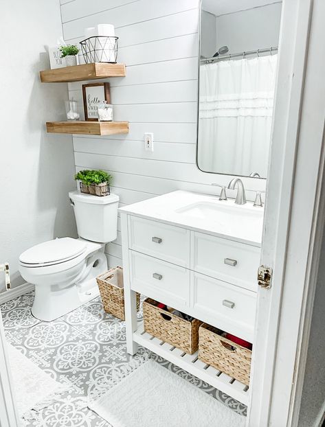 Light and bright updated half bath with white shiplap, light gray walls, and gray vinyl tile meant to look like cement tile. Makeover Kamar Mandi, Small Bathroom Wallpaper, Half Bath Remodel, All White Bathroom, Shiplap Bathroom, Casa Country, Bathroom Remodel Designs, White Vanity Bathroom, Bathroom Remodel Shower