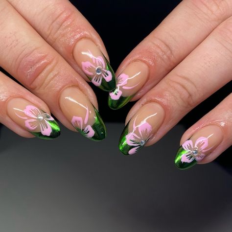 Green chrome tips and pink flowers 🌸 The spring nails are back in force and the bright colours are back, I’m loving it! . . . . . . #bristolnails #bristolnailart #bristolbiab #chromefrenchtips #greennails #springnailinspo Nails Green With Flowers, Pink And Dark Green Nails, Green And Pink Nails Acrylic, Green Nails Flowers, Green And Pink Acrylic Nails, Pink And Green Nails Design, Pink Green Nails, Green And Pink Nails, Chrome Tips