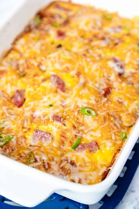 Indulge in the comforting flavors of Ham and Egg Casserole! This easy-to-make recipe is perfect for breakfast or brunch. Creamy eggs, savory ham, and melted cheese come together for a delicious dish the whole family will love. Ham And Egg Breakfast Casserole Potatoes, Diced Ham Breakfast Casserole, Overnight Breakfast Casserole With Hashbrowns And Ham, Veggie Ham And Cheese Breakfast Egg Casserole, Easy Ham Breakfast Casserole, Ham Cheese Egg Bake, Egg And Cheese Casserole Recipes, Ham Egg And Cheese Breakfast Casserole, Breakfast Casserole Ham And Cheese