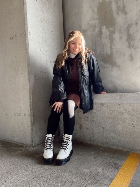 Photo shoot in parking garage, female college student wearing a brown dress with a black leather blazer and tights and white platform doc marten boots White Doctor Martens Outfit, Black And White Doc Martens Outfit, Doc Marten Sinclair Boots Outfit, White Platform Doc Martens Outfit, Dr Martens White Boots Outfit, Martens Winter Outfit, Doc Martens Winter Outfit, Doctor Martens Outfit, Doc Martens Winter