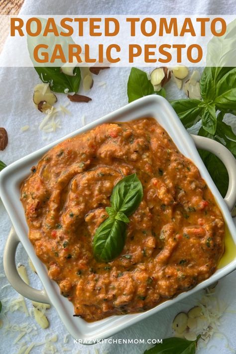 This tomato pesto will redefine the way you think of classic pesto, using roasted tomatoes and garlic to provide an extra kick of flavor and richness. Roasted Tomatoes And Garlic, Garlic Pesto, Baked Garlic, Tomato Pesto, Roasted Tomato, Small Snacks, Toasted Almonds, Sliced Almonds, Stuffed Sweet Peppers