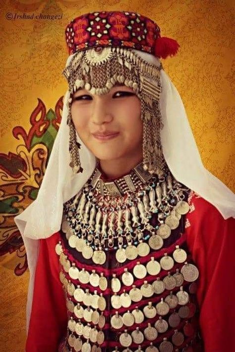 The Hazara people or the Hazaras are an ethnic tribe native to the Hazarajat region of Central Afghanistan. Hazara People, Afghan Hat, Turkish Clothing, Afghan Jewelry, Afghan Fashion, Afghan Clothes, Calf Length Dress, Afghan Dresses, Traditional Dress