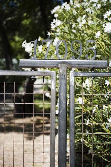 article-image Address Monument, Metal Fence Ideas Steel, Metal Fence Design, Industrial Fence, Ranch Fencing, Scott Adkins, Entry Gate, White Fence, Home Design Magazines