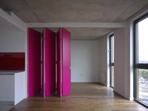 Retractable magenta wall - Trendir Ancoats Manchester, Magenta Walls, Moveable Wall, Accordion Doors, Moving Walls, Movable Walls, Sliding Wall, Micro Apartment, Appartement Design