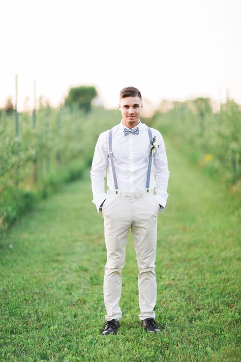 white groom style with light blue bow tie and suspenders Mens Wedding Attire Suspenders, Light Blue Suspenders And Bow Tie, Dusty Blue Suspenders Wedding, Tux With Suspenders, Groom Suspenders Bow Tie, Blue Bow Tie And Suspenders, Light Blue Suspenders, Blue Suspenders And Bow Tie, Country Wedding Groomsmen