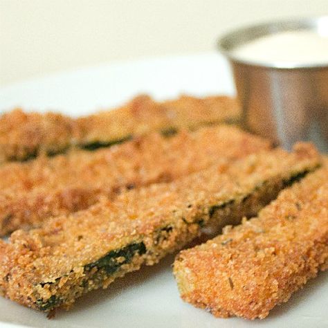 These deep fried zucchini sticks are breaded with panko, parmesan cheese and oregano to create a flaky, crispy, Italian flavoured breading. Dip with ranch or marinara sauce. Deep Fried Zucchini Sticks, Fried Zucchini Sticks, Deep Fried Zucchini, Deep Fryer Recipes, Fried Zucchini Recipes, Deep Fried Recipes, Zucchini Sticks, Fried Zucchini, Veggie Fries