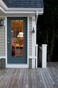 painted back door, captains bell; RFD Architects | Fair Winds Seaside Renovation Back Door Ideas, Knoxville Gray, Painted Exterior Doors, Interior Door Colors, Color Spotlight, Exterior Door Colors, Moody Green, Front Door Colors, Parade Of Homes