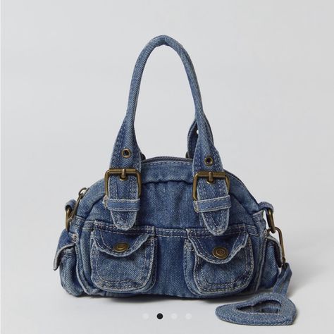 Content + Care - 100% Cotton - Spot Clean - Imported Size - Dimensions: 8.26"| 2.75"W 4.33"H - Strap Drop: 3.93" 90s Purses, Y2k Bags, Urban Outfitters Bags, Jean Purse, Denim Crossbody, Denim Handbags, Denim Purse, Crochet Clothing And Accessories, Buy Bags