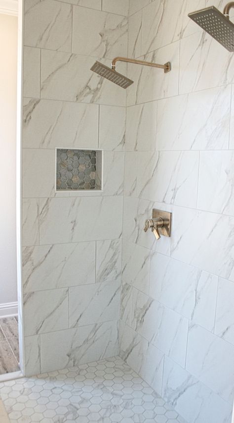 Marble Floor And Shower Bathroom, Honed Marble Shower Tile, Calacatta Hexagon Tile Bathroom, Shower Tile Gold Fixtures, Marble Look Porcelain Tile Bathroom Shower Walls, Master Shower Floor Tile, Marble Slab Shower Walls, Marble Tile Shower Walls, Porcelain Tile Shower Walls