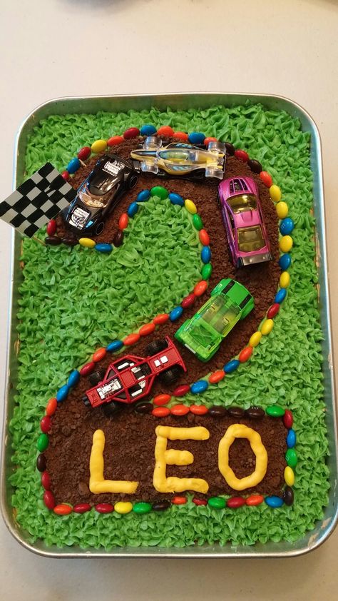 Hot Wheels - Matchbox - Race car birthday cake for a car-crazy two year old! Chocolate crazy cake (egg free, dairy free), butter frosting (non dairy butter) and chocolate graham  cracker crumbs for the road. Vroom! Car Themed Cake, Pool Birthday Cakes, Toddler Birthday Cakes, Race Car Cakes, Cars Birthday Cake, Airplane Birthday Party, 2 Birthday Cake, Chocolate Graham Crackers, Race Car Birthday