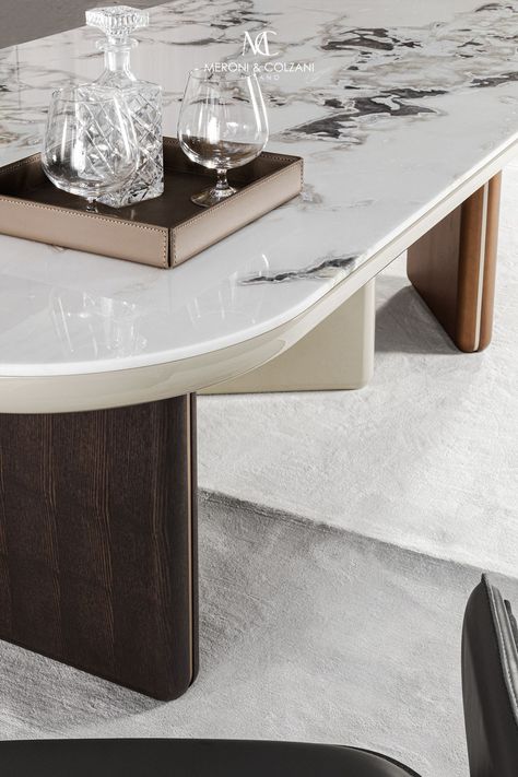 The Maggiore table features three legs arranged perpendicularly to each other to create dynamism and personality. Two vertical lines on the sides of the bases are an additional visual detail that creates a sense of motion. The soft-contoured top is available in the MC colours and can come with added inlays in various materials such as marble and back-painted glass. A table offering endless customisation possibilities.  Design: Bonura design Marble Dinning Table, Back Painted Glass, Marble Table Top, Vertical Lines, Materials And Textures, Table Side, Wooden Dining Tables, Marble Table, Nouveau Art