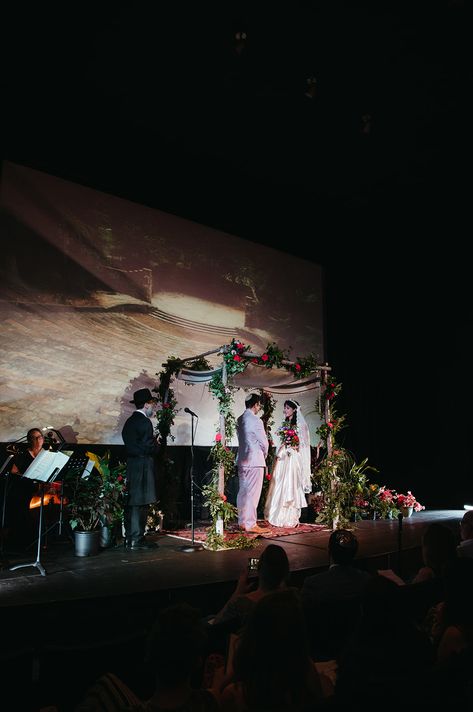 Fun, eclectic wedding in Chapel Hill. Wedding Ceremony at a Movie Theater. Purple groom outfit. Alternative wedding attire. Jewish wedding ideas. Alternative Wedding Attire, Hill Wedding Ceremony, Jewish Wedding Ideas, Purple Groom, Retro Inspired Wedding, Eclectic Wedding, Hill Wedding, Wedding Scene, Ceremony Music