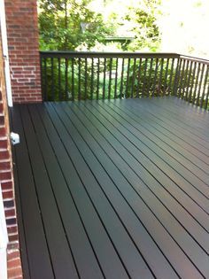 We wound up using Behr solid stain in Slate. We chose it because of its scores on a Consumer Reports test and we generally have had good results from Behr products. Our deck "after" painting. We liked the effect of the old Behr semi-transparent Redwood color showing through, so we left it. Grey Deck Paint, Porch And Patio Paint, Deck Paint Colors, Paint Deck, Deck Stain Colors, Solid Stain, Deck Colors, Wooden Deck, Painting Concrete Porch