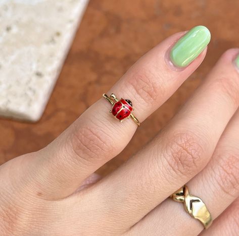 14KT yellow gold red ladybug youth size ring. This is a YOUTH size ring that is also adjustable to fit a number of child/ baby sizes. For adults this ring would be a midi ring (as shown in photo). Size 1.5 and stretches to size 3 Weight: .59 gram Band width: 1.17mm One size only; adjustable Solid 14K Funky Jewelry Rings, Ladybug Accessories, Blueberry Emoji, Ladybug Ring, Ladybug Jewelry, Girl Ring, Dope Jewelry Accessories, Funky Rings, Fantasy Earrings