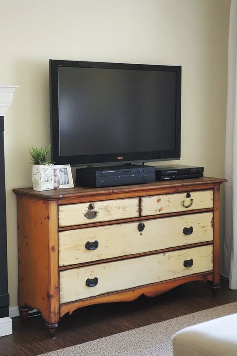 "Elevate your media setup with a Repurposed Dresser TV Stand! 🛠️📺 Perfect for a creative and budget-friendly solution. 🌟✨ #DIYFurniture #TVStandMakeover #RepurposedDecor" Tv On Dresser, Dresser Into Tv Stand, Cottage Tv Stand, Tv Stand Makeover, Dresser Tv, Dresser With Tv, Dresser Tv Stand, Repurposed Dresser, Repurposed Decor