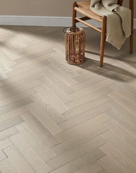 Tired of the same old boring flooring? This superb Oxford Herringbone Pearl Grey Oak is an affordable, yet highly specified engineered wood floor. With it charming natural wood markings and authentic wood knots, it will truly make a chic statement in your home. Consisting of seven coats of super lacquer, this wood floor will dazzle with its creamy beige hues and soft grey undertones. Its outstanding 3mm wear layer, will ensure your flooring lasts for years to come. Our Oxford Herringbone Pearl G Engineered Wood Floors Oak, Herringbone Floors, Direct Wood Flooring, Herringbone Wood Floor, Herringbone Wood, Engineered Wood Flooring, Herringbone Floor, Flooring Inspiration, Herringbone Design