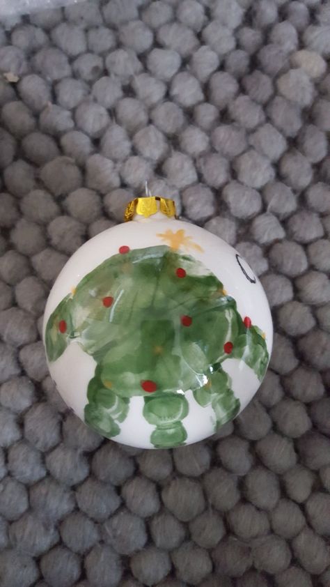 Handprint Xmas tree bauble Hand Print Baubles, Handprint Christmas Bauble, Handprint Christmas Ball Ornaments, Bauble Painting Ideas Kids, Handprint Bauble, Handprint Ornaments Diy, Preschool Christmas Gifts, Childrens Christmas Crafts, Baby Christmas Crafts