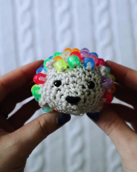 Have you seen my videos of these little babies?! I cannot stop making them! I found this pattern on Facebook last weekend, bought it, and immediately made 2 of them in just a few hours. If you've got some worsted weight yarn and some pony beads you can make a fidget hedgehog too! I have a few in my shop now if you don't want to make one yourself, but if you want the pattern just comment "pattern please" below and I'll send you the link! #fidgettoy #fidget #fidgethedgehog #fidgettoy #croch... Hedgehog Crochet Pattern Free, Hedgehog Crochet Pattern, Two Hedgehogs, Hedgehog Crochet, Crochet Fidget, Bright Rainbow, Rainbow Beads, Hedgehogs, Pony Beads