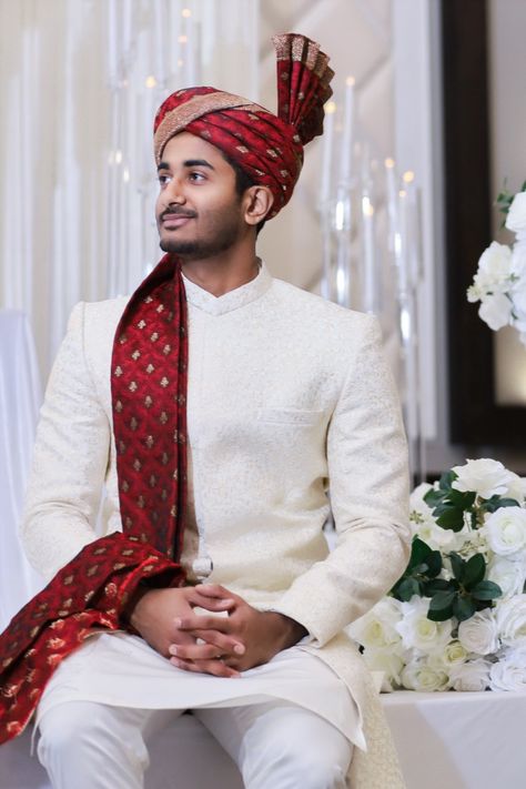 The groom sits down in front of the decorated stage to take some pre-wedding photos before the ceremony begins. Indoor venue in Toronto, Ontario, Canada. Sitting Down Pose, Emotional Moments, Toronto Ontario Canada, Indian Groom, Gardens Wedding, Pre Wedding Photos, Pre Wedding Photoshoot, Toronto Ontario, The Groom