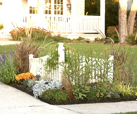 Dress up your driveway to improve curb appeal! See more easy ideas: http://www.bhg.com/home-improvement/exteriors/curb-appeal/make-a-better-first-impression/?socsrc=bhgpin100212dressupdriveway#page=8 Corner Flower Bed, Beds Ideas, Driveway Entrance, White Fence, White Picket Fence, Fence Landscaping, Backyard Fences, Picket Fence, Garden Fence