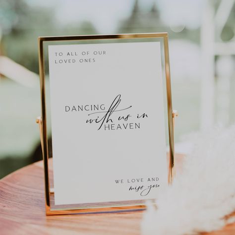 Remember your loved ones in a special way with our "Dancing With Us in Heaven" sign. This loving memory table sign is perfect for weddings, allowing you to honor those who are no longer with us but forever dancing in heaven. Our editable sign features a heartfelt message that will bring comfort and warmth to your celebration. Light a candle and let their presence be felt as you commemorate them with this beautiful in memory sign. Include this touching heaven wedding sign in your wedding signage Heaven Sign For Wedding, Those In Heaven Wedding Sign, Lost Loved Ones Wedding Memory Table, Wedding Memory Wall, Wedding Memory Chair, Memorial Table Sign Wedding, Wedding Remembering Loved Ones, Memory Table Wedding Display, In Memory Table