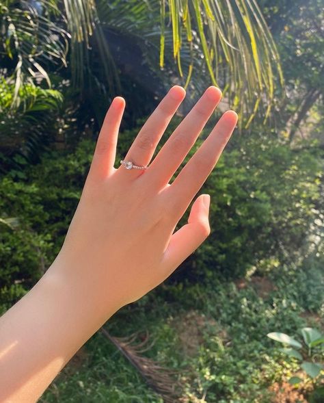 this is a beautiful photo of a simple and cute hand taken in sunlight during the day. she is wearing a small diamond ring in her ring finger Hand With Ring, Small Diamond Ring, Hands With Rings, Small Diamond Rings, Finger Hands, Hand Rings, Her Ring, Korean Babies, Beauty Mark