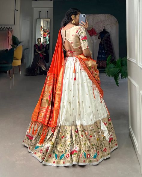 *🌷Paithani collection 🌷* "Captivate hearts and turn heads in our Jacquard Silk Paithani Lehenga Choli - where every detail reflects the essence of tradition🩵. *Catalogue : AAKANKSHA* *2021PEC* *2021SBL* *2021PRL* *2021WHT* *Lehenga(Stitched)* Lehenga Fabric : Jacquard Silk(Paithani) Lehenga work : Weaving Zari Work Waist : SUPPORTED UP TO 42 Length : 41 Flair : 3.50 Meter Stitching : Stitched With Canvas and Can Can Lehenga Closer : Drawstring with Handmade Tassels Inner : Micro Cotton... Paithani Saree Dress Design Ideas, Paithani Lehenga Half Saree, Paithani Saree Dress, Saree Dress Design Ideas, Gst India, Paithani Dupatta, Paithani Lehenga, Bridal Wear Indian, Lehenga Stitched