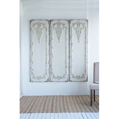 Inspired by ornate, old-world embellishments in French-country homes and estates, this 3-piece set of wall panels brings an eye-catching sense of dimension to any room in your home. Each one measures just under 71" tall and 21" wide to create a dynamic accent for your walls. It features a white finish that's been distressed to create a weathered textural effect, lending a timeworn appearance to your space. Intricately carved floral paneling adds visual interest and completes the overall design w French Panelling Walls, Coastal Headboards, Door Trim Ideas Interior, French Country Wall Decor, French Room, Flowers Wall Decor, Shabby Chic Wall Decor, Modern Farmhouse Bathroom Rug, Handmade Farmhouse