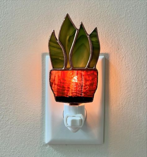 Swipe to turn on the light! 🪴 Stained glass nightlights coming soon! ✨ . . #plantlover #snakeplant #stainedglassart #botanicalart Stained Glass Nightlight, Glass Night Lights, Stained Glass Night Lights, Daisy Ring, Snake Plant, New Home Designs, Stained Glass Art, Stain Glass, Night Lights