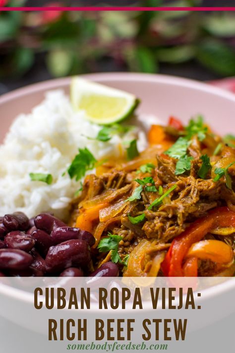 Slow-cooked shredded beef and vegetables that resemble a pine of colourful rags is what Cubans call Ropa Vieja. From the Spanish term for “old clothes”, this rich beef stew is one of Cuba’s most popular and beloved dishes. #cubanrecipes #cubanbeef #beefstew #slowcookedbeef Cuban Stew Beef, Cuban Ropa Vieja Recipe Slow Cooker, Cuban Shredded Beef, Spanish Shredded Beef, Slow Cooked Beef Stew, Shredded Beef Stew, Mexican Shredded Beef Dutch Oven, Cuban Ropa Vieja, Ropa Vieja Recipe