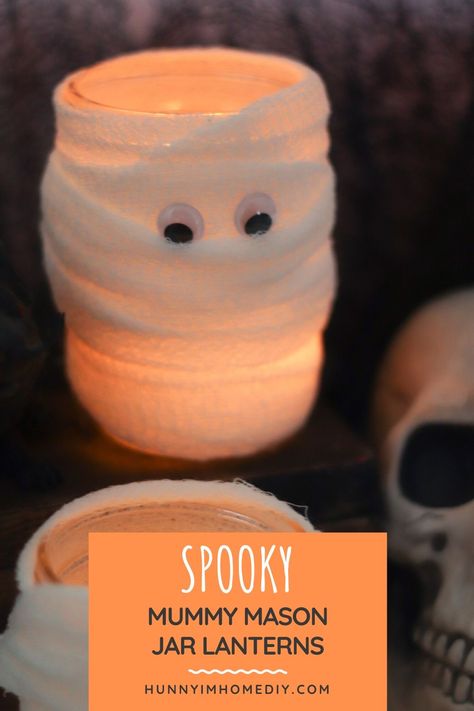 These adorable mummy candle jars are easy Halloween decorations DIY. You'll love this mummy candle holder because they're easy Halloween crafts. If you're searching for simple Halloween decor, this mummy lantern craft is perfect. Mummy lanterns also make great Halloween crafts for kids easy. In addition to being cute Halloween decor, these mason jar mummy luminaries are also cute mason jar halloween crafts and mason jar Halloween decor. #masonjar #Halloween #craftsforkids Super Simple Mummy Jar Lanterns, Diy Mummy Decorations, Mummy Lanterns, Halloween Craftsforkids, Easy Halloween Decorations Diy, Mummy Candles, Mummy Jar, Mummy Decorations, Simple Halloween Decor