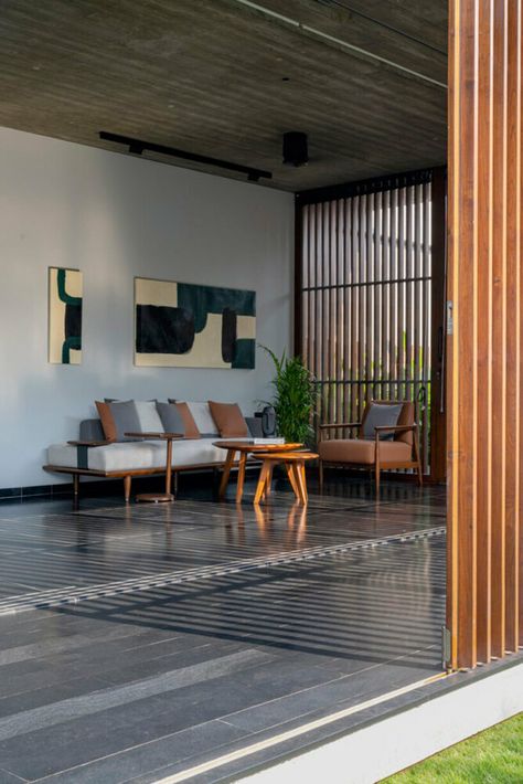 workspace in india showcases a material palette of wood, and kota stones Kota Stone Flooring, Sliding Folding Doors, Timber Buildings, Material Palette, Concrete Wood, Studio Space, Stone Flooring, Formal Living, Office Interior Design