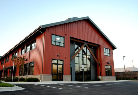 Board and Batten exterior finish with standing seam roof, commercial storefront and exposed wood structural elements create an Annapolis twist on a Pacific Northwest American look. This 2 story office building is set up to be for mix of Office and Retail end users. Warehouse Business Ideas, Modern Warehouse Design Exterior, Commercial Steel Buildings, Hobby Garage, Board And Batten Exterior, Metal Building Designs, Factory Architecture, Commercial And Office Architecture, Warehouse Design