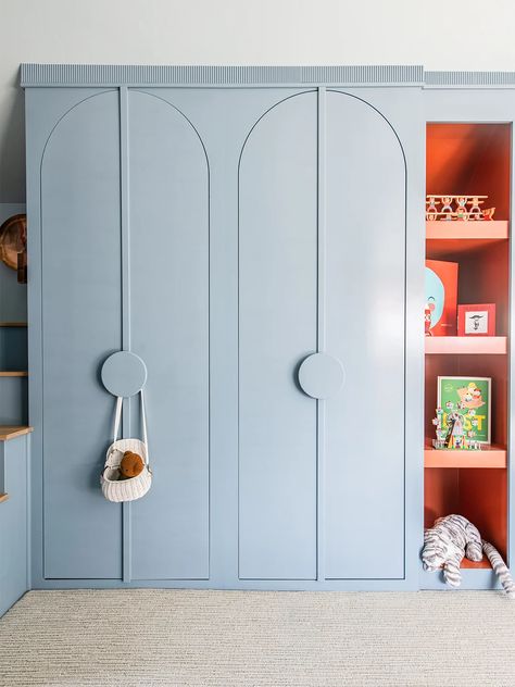 When Friends Sleep Over, This Playroom’s Double Bunks Are Also Front-Row Movie Seats | domino Playroom Wardrobe Storage, Built In Wardrobe Kids Room, Playroom Cupboards, Playroom Toy Storage Ideas, Playful Interior Design, Kids Room Closet, Arched Cabinet Doors, Closet Playroom, Kids Playroom Design