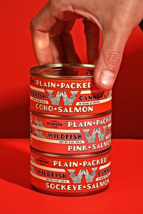 In their work for Alaskan fish company Wildfish, Young Jerks connects the wider interest in tinned fish to a growing popularity of tins with a charming vintage aesthetic. While its midcentury typography and old-school symbology feels current, the agency actually wanted to swerve away from trendiness and lean into a timeless feel. We think these thoughtful red tins hit the nail on the head. Tinned Fish, Lata Vintage, Food Graphic Design, Vintage Packaging, Beer Packaging, Food Packaging Design, Tea Packaging, Graphic Design Trends, Beverage Packaging