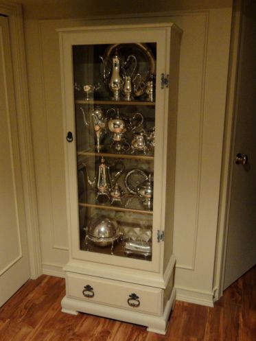 Old gun cabinet converted into a display case. A neighbor of mine set an old gun cabinet at the curb that I brought home and converted into something similar to this, only mine is painted black. Redo Cabinets, Silver Cabinets, Cabinet Makeover, Diy Furniture Renovation, Repurposed Items, Furniture Renovation, Repurposed Furniture Diy, Refurbished Furniture, Recycled Furniture