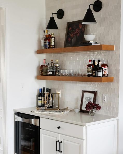 Instead of tearing out the entire bar of our Ravenna I kitchen, we decided to salvage and paint a portion of the cabinetry, add floating shelves, a tile backsplash and sconces above. We removed the element that was really making the space feel dated…the angled wall, and replaced the rest of the cabinetry with a freestanding hutch. Is it easier to just tear everything out and start from scratch? 100% yes. Is it more rewarding to find creative solutions to challenges, while keeping what we can?... Floating Shelves With Tile Backsplash, Sconces Above Floating Shelves, Shelf Backsplash, Angled Wall, Oven Hood, Floating Shelves Kitchen, Mirror Backsplash, Furniture Placement, House Remodel