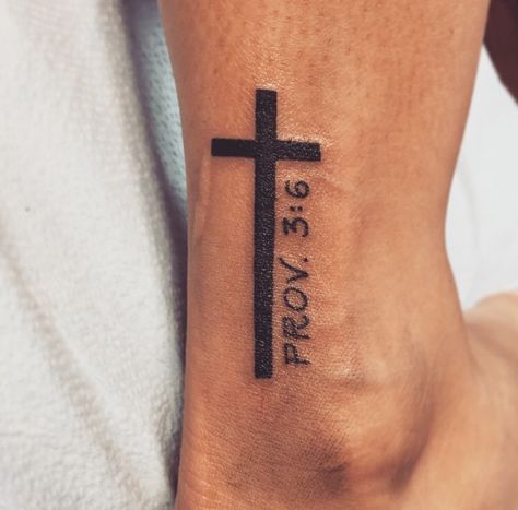 Cross with bible verse Cross With Bible Verse Tattoo For Men, Men Bible Verse Tattoos, Cross Bible Verse Tattoo, Cross With Bible Verse Tattoo, Cross On Forearm Tattoo, Cross With Bible Verse, Bible Verse Tattoos For Men, Cross Tattoo On Wrist, Biblical Tattoos