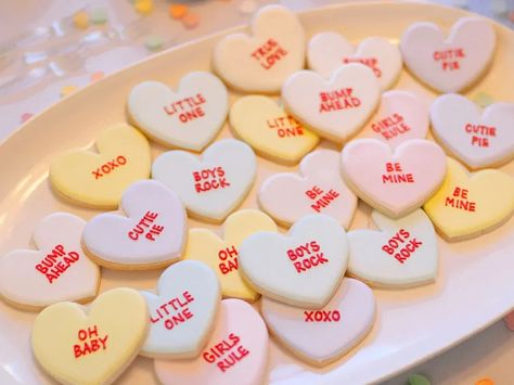 50 Epic Ways to Throw a Gender Reveal Party | The Dating Divas Hearts Baby Shower Theme, Valentines Gender Reveal, Sweethearts Candy, Best Gender Reveal, February Baby Showers, Themed Gender Reveal, Sweetheart Candy, Gender Reveal Cookies