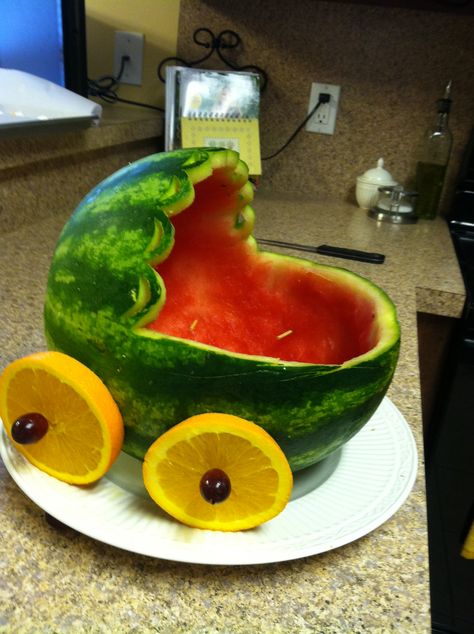 A watermelon bassinet! This is what the fruit salad is going in for my aunt's baby shower! I used a jack-o-lantern carving kit to help me with the details. Baby Shower Fruit Tray, Watermelon Baby Carriage, Baby Shower Desserts Girl, Baby Shower Finger Foods, Baby Shower Watermelon, Baby Shower Fruit, Gateau Baby Shower, Fruits Decoration, Watermelon Baby