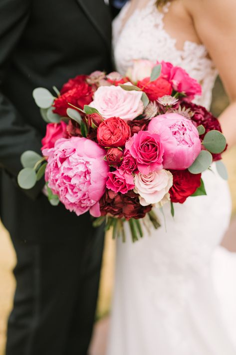 This red and pink wedding was filled with so many gorgeous blooms. From deep reds to blush this was over the top.  Sometimes we don't know the cost of bridal bouquets- this baby goes for $350+ based on garden roses and peonies highlighting this luxury look. Pink And Red Bouquet Wedding, Red And Pink Bridal Bouquet, Pink And Red Wedding Bouquet, Bright Pink Wedding Theme, Red And Pink Bridesmaid Dresses, Pink Table Centerpieces, Pink And Red Wedding Flowers, Red And Pink Wedding Flowers, Peonies Bouquet Wedding